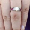 model wearing 1- SIVYAA Solitary pearl framed with white CZ & Square Cut Ruby pure silver Finger Band