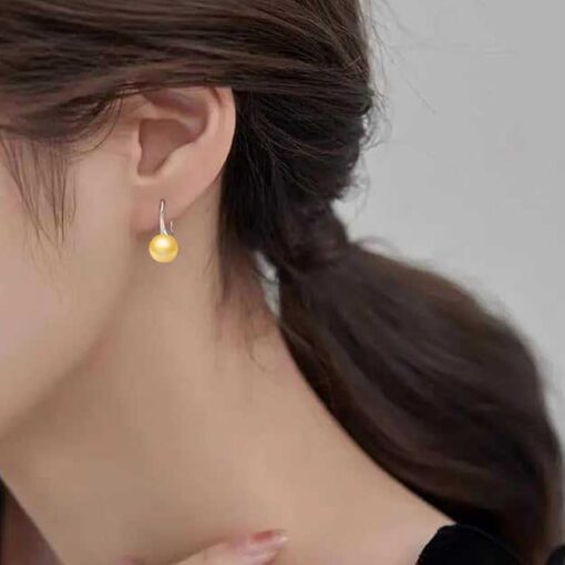 model wearing - SIVYAA Fresh Water Gold Pearl Tiny Drop Dangle pure silver Earrings