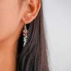model wearing- SIVYAA Linear pure silver Earrings Studded with Round Garnet