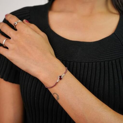 model wearing - SIVYAA Red Maroon faceted Beads and Pear Solitaire Garnet Chain pure silver Bracelet