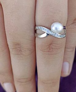 model wearing -SIVYAA White Fresh Water Pearl & Cubic Zirconia pure silver Criss-Cross Finger Ring
