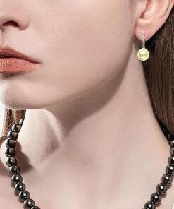 model wearing- SIVYAA Solitaire Classic Gold Pearl Drop Dangle Hoop Earrings