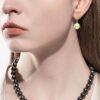 model wearing- SIVYAA gold finish Solitaire Classic Gold Pearl Drop Dangle Hoop Earrings