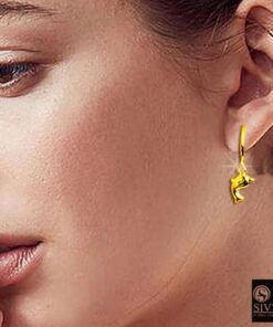 SIVYAA model wearing- gold dolphin charm silver hoop bali