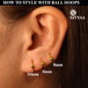 model wearing small ball hoop style gold-1