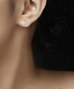 model wearing SIVYAA Silver Moon n Star Round CZ Stud Earring
