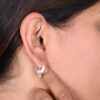 Model wearing SIVYAA 925 sterling silver 15mm crescent hoop earrings with ethnic outfit